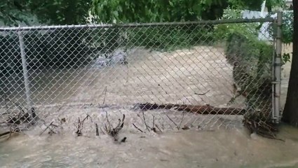 Neighborhood transforms into flooded creek