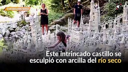 Suiza realizan una escultura de un castillo a orillas de un río seco