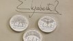 Queen Elizabeth's iconic signature appears on new coin