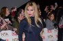 Katie Price claims she is still with fiancé Carl Woods
