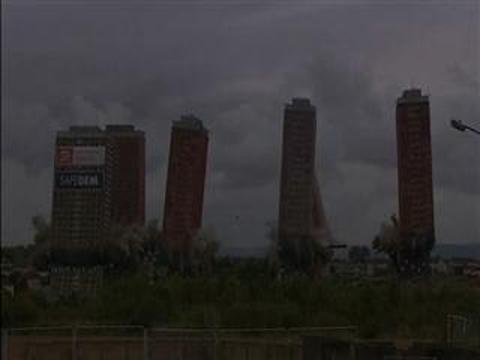 Dramatic scenes in Glasgow as demolition of iconic towers leaves two standing