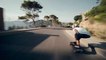 Guy Skateboards Through Sharp Turns of Scenic Route