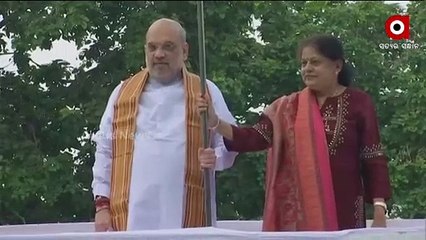 Union Home Minister Amit Shah along with his Wife Hoist the Tricolour at their Residence in Delhi