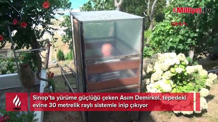 Tepedeki evine 30 metrelik raylı sistemle inip çıkıyor