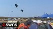 Tornado sweeps through UK music festival sending tents flying into the air