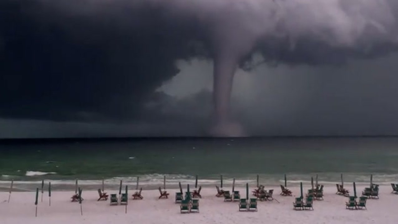 Large waterspout looms offshore