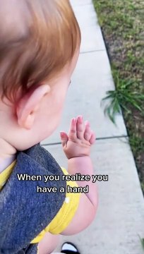 baby girl hilariously discovers her own hand