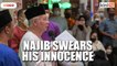 Najib takes oath in mosque, swears his innocence in SRC case