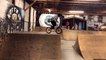 BMX rider jumps off top of half pipe at skatepark and faceplants