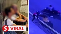 Passers-by stop motorcyclists from snatching woman's handbag in KL