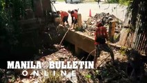 DPWH Davao collects trash from the drainage creek in Lanang, Davao City