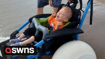 Mum moved to tears after disabled son finally gets to play in the sea thanks to beach wheelchair