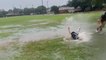 Texas football players take advantage of the rain