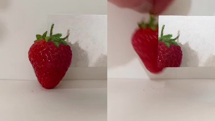 Brilliant artist perfectly matches hues while painting a strawberry