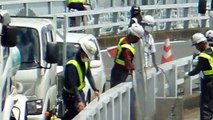 Eight Dudes Watching One Dude Working in Japan