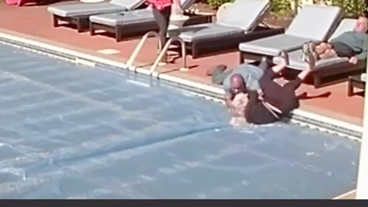 Lady runs toward pool to save drowning pup, ends up falling in herself