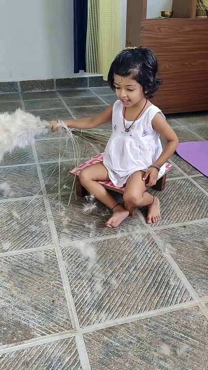 Baby playing with white flower❄️