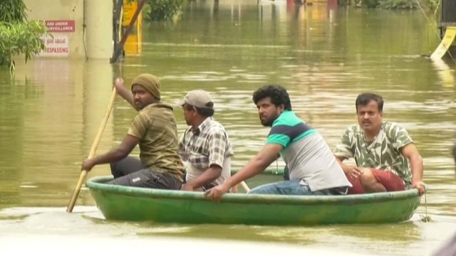 Boats and tractors on streets of India’s Silicon Valley as flash floods bring Bangalore to a halt