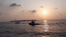 Amazing Sunset and boats and ships on the beach of Male (Maldives)