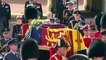 The Queen's coffin is transported from Buckingham Palace to Parliament in military procession
