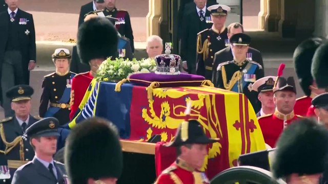 The Queen's coffin is transported from Buckingham Palace to Parliament in military procession