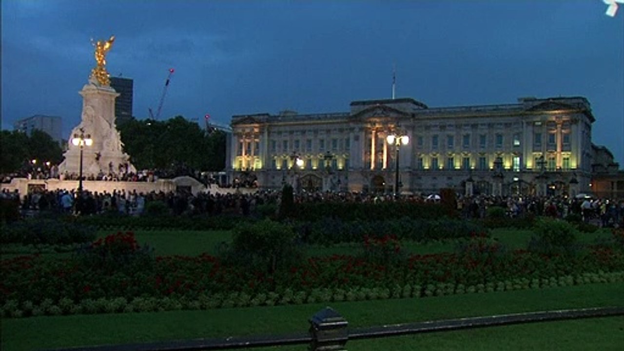 Crowds gather outside Buckingham Palace