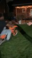 Guy Crashes Into Table While Riding Dirt Bike in Yard