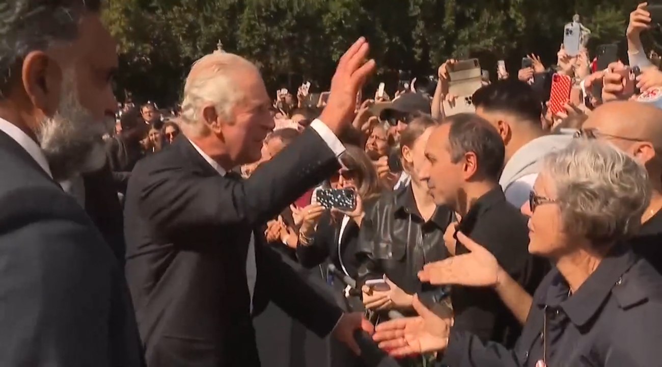 King Charles and Queen Consort greet crowds outside Buckingham Palace