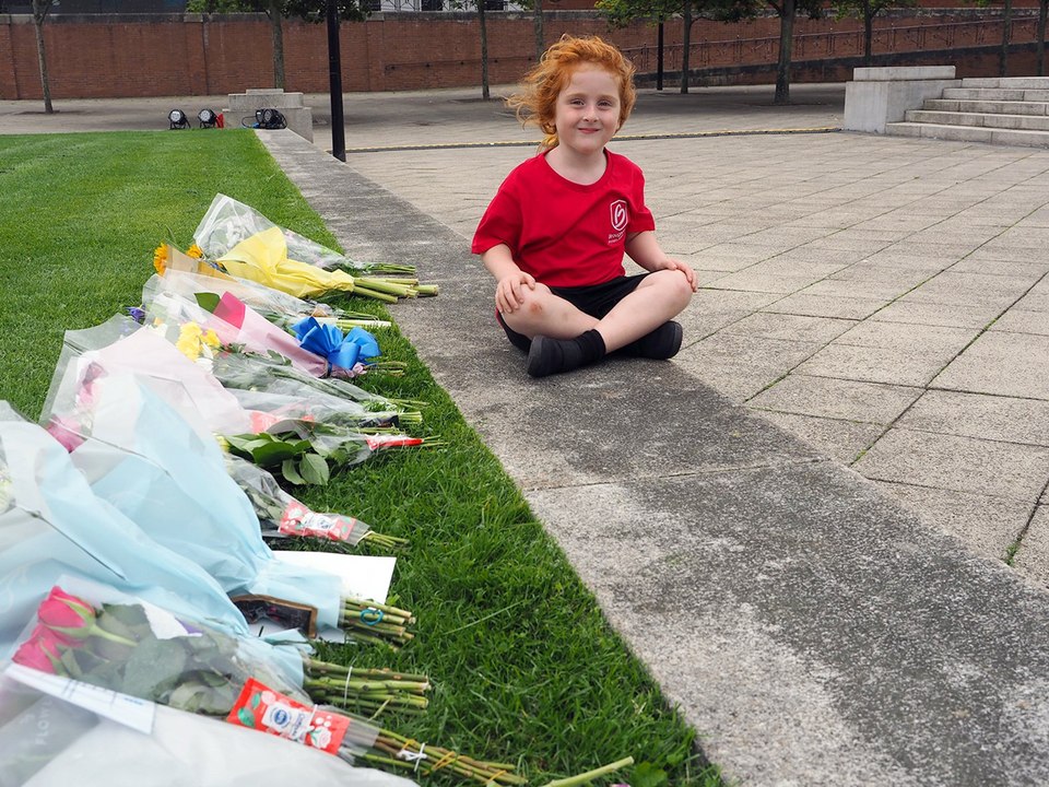 Emily Birbeck, five, lays flowers at Hartlepool War Memorial in tribute