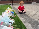 Emily Birbeck, five, lays flowers at Hartlepool War Memorial in tribute to the Queen