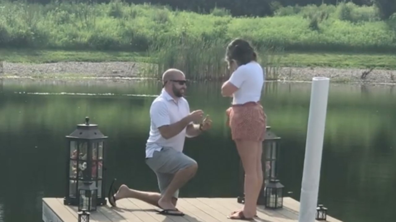 Long Parade Of Family And Friends Leads Woman To Proposal Surprise | Happily TV