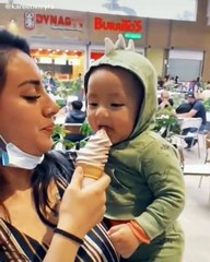 Baby thinks eating ice cream is absolutely hysterical