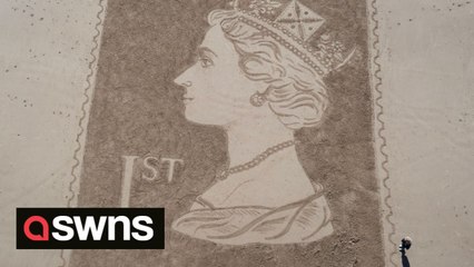 Sand artist creates moving portrait of The Queen on a beach