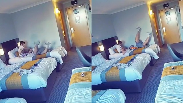 'Son hilariously kicks dad's butt and pushes him off the bed'