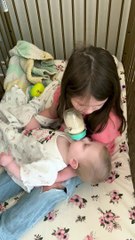 Girl Hums to Baby Sister