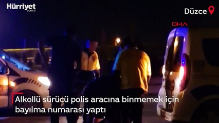 Alkollü sürücü, polis aracına binmemek için bayılma numarası yaptı