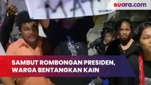 Sambut Rombongan Presiden, Warga Bentangkan Kain Bertuliskan 'Jokowi Sampai Mati'