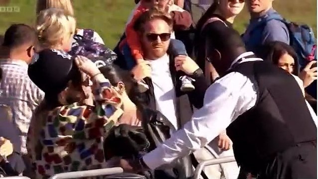 Met Police officer goes viral after he's filmed posing for selfies and lending his hat to members of the public for photos as they queued to see the Queen lying-in-state