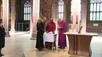 Edward and Sophie light candles for the Queen