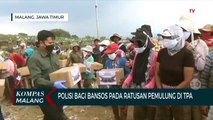 Polisi Bagi Bansos Paket Sembako ke Ratusan Pemulung di TPA Supit Urang