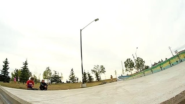 Skateboarder does kickflip off platform at skatepark and board bounces up then hits him on his face