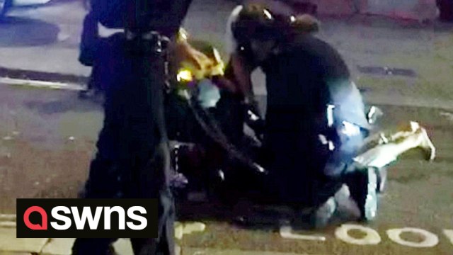 Shocking footage shows the scene just moments after two police officers were stabbed early this morning