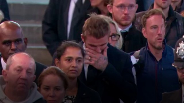 David Beckham breaks down after standing in line for 12 hours to pay his respects to Queen Elizabeth II.