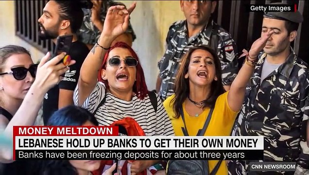 Woman takes hostages in bank to get her own money out