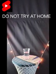 Science experiment with glass of water and fire