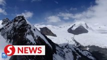 Glaciers sit among the clouds in Qinghai Province