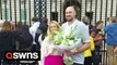 Tyson Fury pays his respects to the Queen by laying flowers outside Buckingham Palace