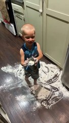 Kid makes an enormous mess on the kitchen floor