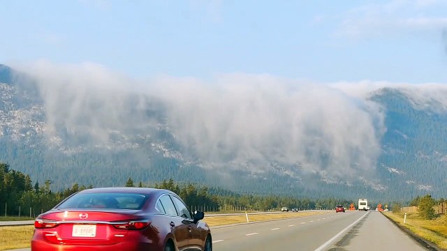 A Waterfall of Clouds in the Mountains