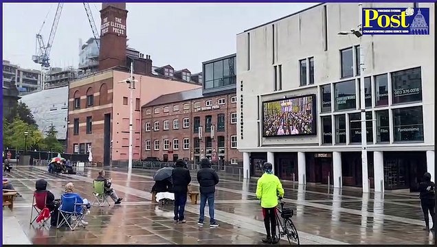 Crowd falls silent as they watch the Queen's funeral in Millennium Square